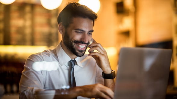 Financial trader looking at laptop