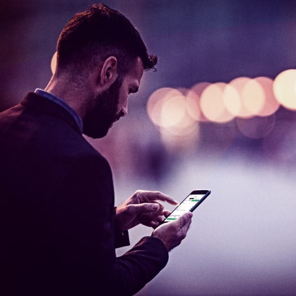 A trader using Smartphone to contact us